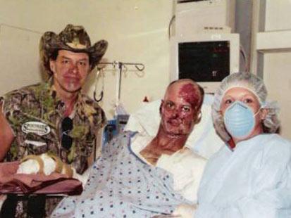 Army Staff Sgt. Michael Mills, pictured with his wife, Suhanna, and musician Ted Nugent, had his face rebuilt after an IED blast in Iraq.