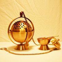 This is carried by the thurifer in the right hand. It can also be called the censer.