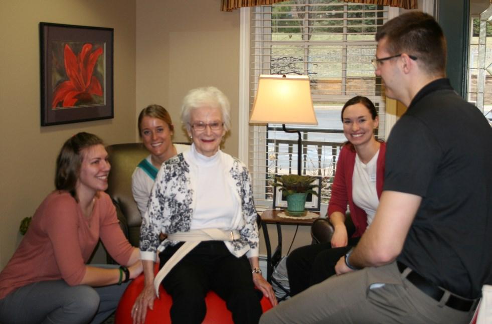 A graduate level therapy student and an undergraduate student are paired with an Assisi resident.