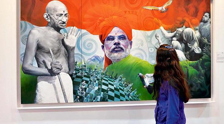 Editor s Desk A painting Sons of the Soil by artist Vivek Sharma at the 7th edition of Indian Art Fair displaying the Mahatma showing his blessings on Modi Gandhi in Digital India!