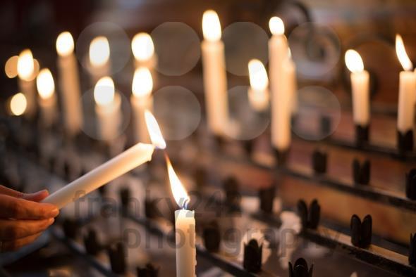 The Lighting of Candles at the Altar Catholics traditionally light candles to accompany their