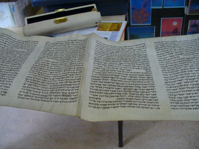 was hand written and contains writing from the Torah; they explained how this is the Jewish Holy book containing the Old Testament part of the Bible.