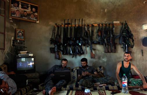 Khalil Hamra AP Free Syrian Army fighters sit in a house on the outskirts of Aleppo, Syria.