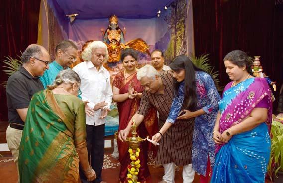 Ms. Sindhu Lokanath and other dignitaries take part in lighting the lamp to mark the inauguration of a nine day doll exhibition This event also