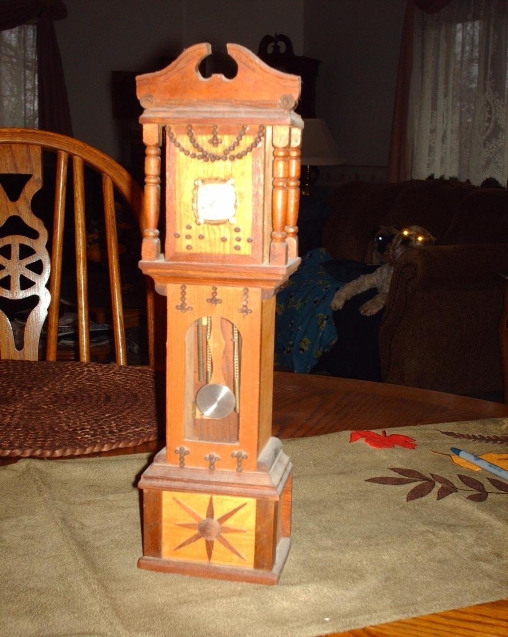 Owner Larry Wise (grandson) Size 14 High x 4 Wide This miniature grandfather clock was made with