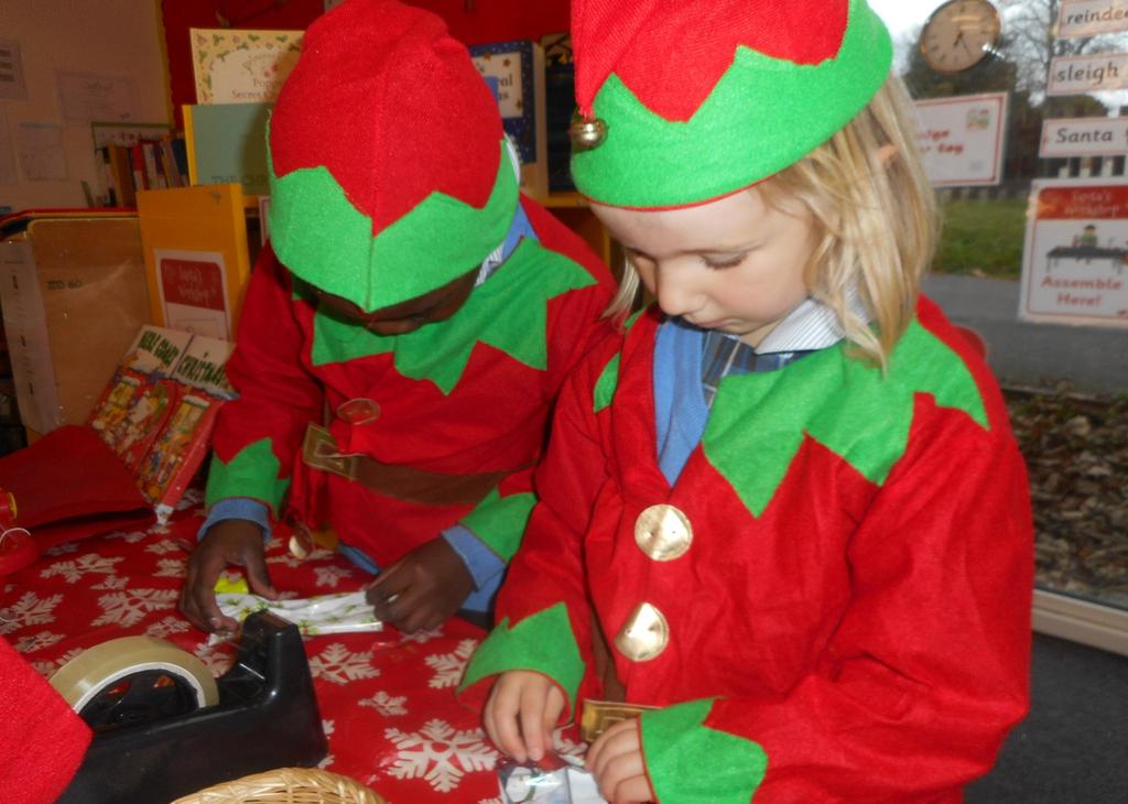 The children have been invited to help in Santa's workshop and were busy preparing and wrapping all the