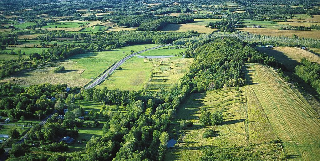 AERIAL PHOTOGRAPH OF THE HILL CUMORAH AND SURROUNDING AREA BY CRAIG DIMOND Near Palmyra, New York, the Hill Cumorah is about three miles (4.8 km) southeast of the Smith family farm.