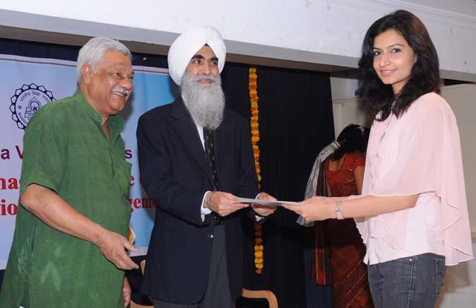 Ms. Vanishree N., receives certificate and cash award from Dr.