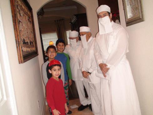 the three young Zoroastrian brothers: Kyle, Brennan and Nicholai, their proud parents Katya and Kaizad,