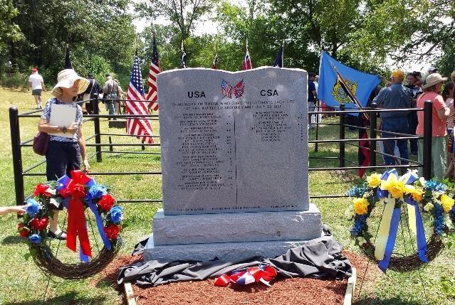 monument for the mass grave at Moore s Mill in July.