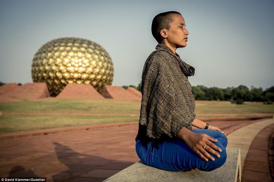 +15 An Auroville resident is seen meditating at the