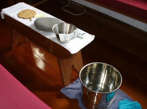 A place to sit or kneel and read pre-written prayers, a list of parish leaders, vestry and ministries that people may like to pray for, candles to light, the NZ prayer book open at morning, mid-day