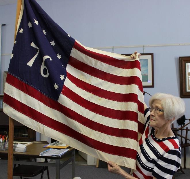 JAN MERRITT WITH BENNINGTON FLAG DAR FLAG PROGRAM The DAR holds monthly meetings at the Jasper County Historical Society.