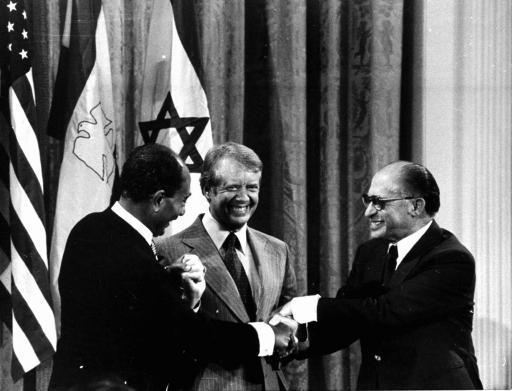 From the left, Egyptian President Anwar Sadat, President Jimmy Carter, and Israeli Prime Minister Menachem Begin shake