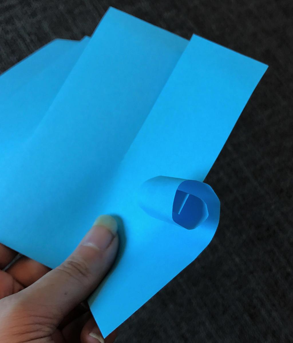 Roll each section up, then let it go Glue the edges of the blue paper on the edges