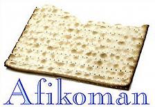 PARTICIPANT: The middle matzah is broken into 2 pieces. The larger piece is wrapped in a napkin as a symbol of the afikomen that was saved and eaten as dessert.