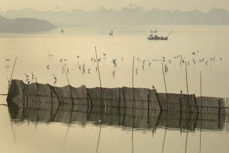 On the outskirts of Mandalay is one of the most photographed locations in Myanmar the U Bein Bridge, a