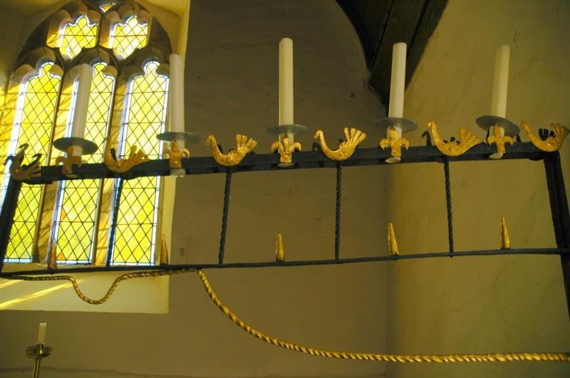 Candle holders by the altar at Rowlestone We then travelled further south to Rowlestone in search of the famous Rowlestone Tympanum at St Peter's Church, which is a carving inside the entrance