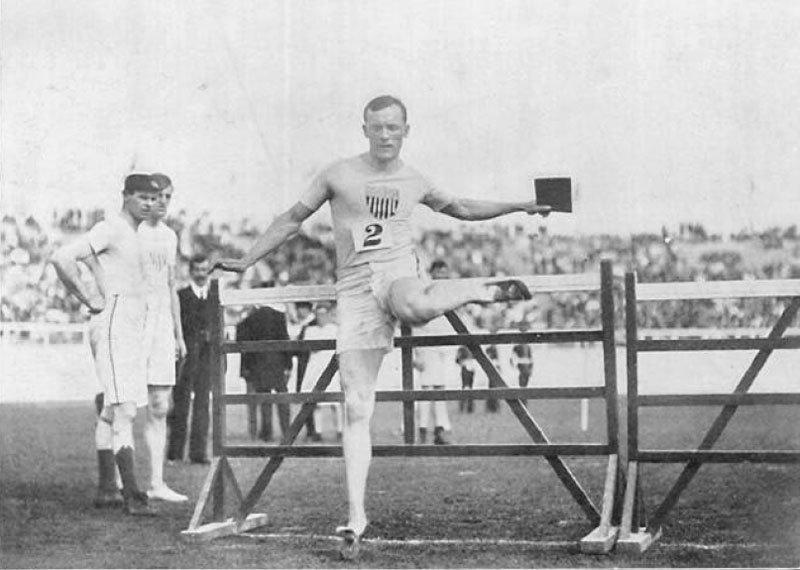 Running with the Word: American athlete, Forrest Smithson, winner of the 110m hurdles at the London 1908 Olympics. This picture shows him jumping with a Bible in his hand.