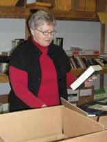 Sheila McLaughlin, a member of the AIM USA staff, checks in a newly-arrived box of books. The box of books was indeed a wonderful gift!