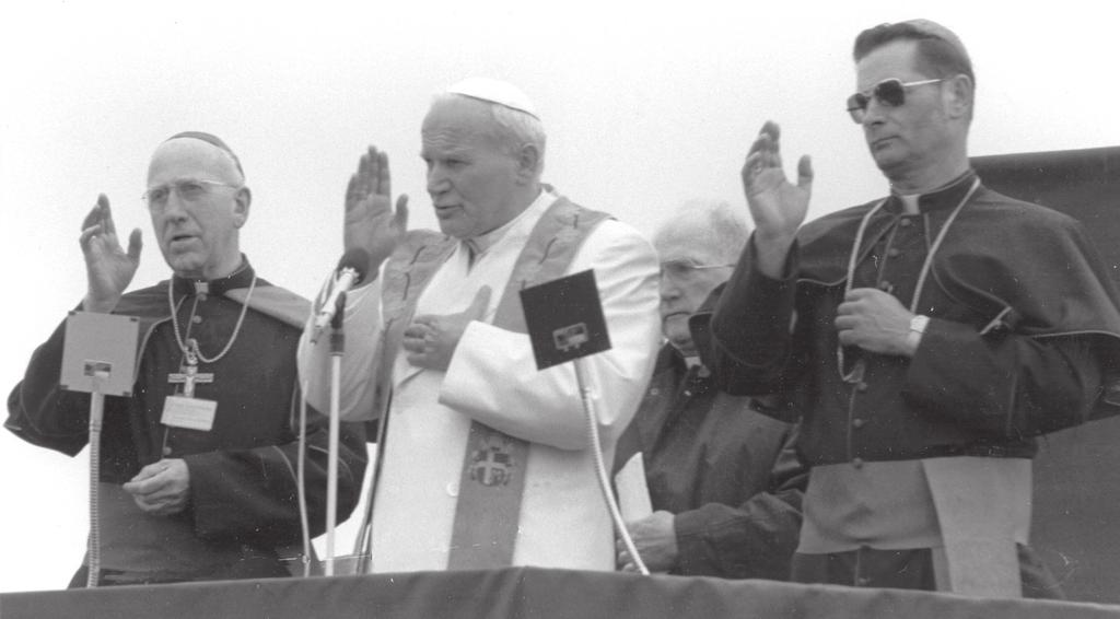 Bishop Robert L. Whelan, S.J., Pope John Paul II, and Bishop Michael J. Kaniecki, S.J., confer a blessing upon the people of Fairbanks, Alaska, on May 2, 1984.