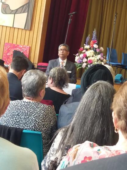 Rev Manas Ghosh, Pastor at Leigh Memorial Church welcomes people to the