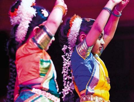 Below, from left: Bharatanatyam dancers perform in the Salt Lake Tabernacle during an Interfaith Music Tribute in February 2010. An audience member enjoys the tribute.