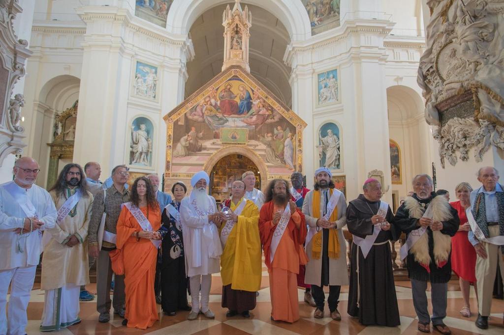 Religious Leaders outside of the Portiuncula within the Basilica of Saint Mary of the Angels, holding the water contained in the heart shaped vessel. From left: Jonathan Granoff, Mohanji, A.K.