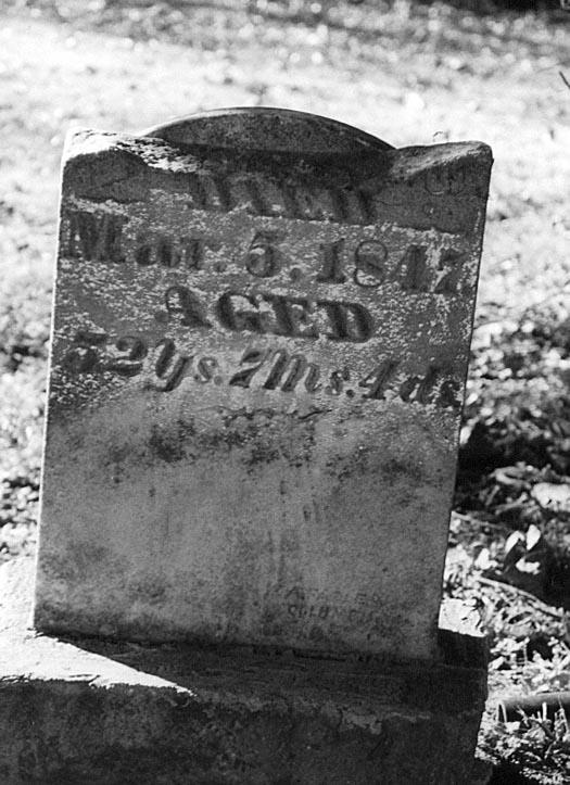 Broken headstone of William Franklin Nichols