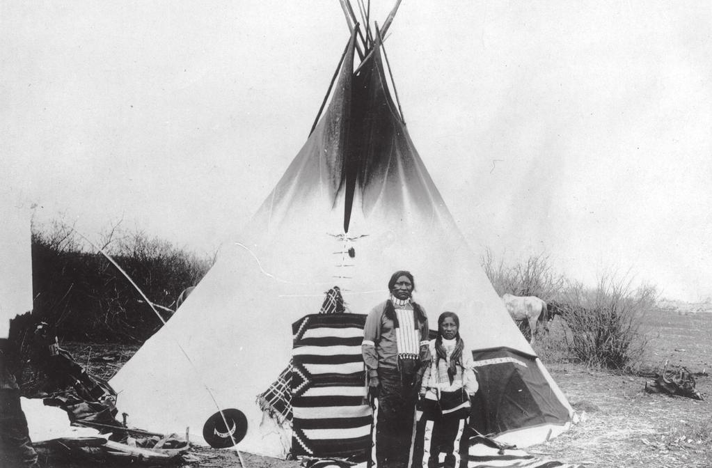 Indian Relations in Utah during the Civil War 219 Two Native American Utes standing in front of a tepee wearing decorative clothing including hair pipe breastplates, chokers, and beaded leggings