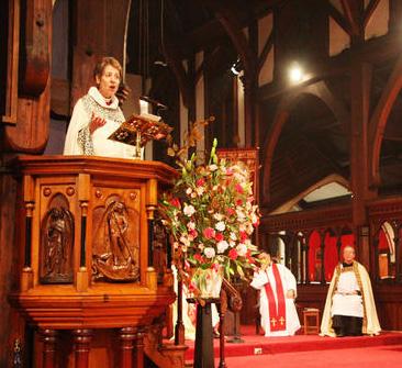 Pick one thing from this photograph which suggests that the person is preaching during a religious service. (Source:www.anglicantaonga.org.nz) (2 marks) B.