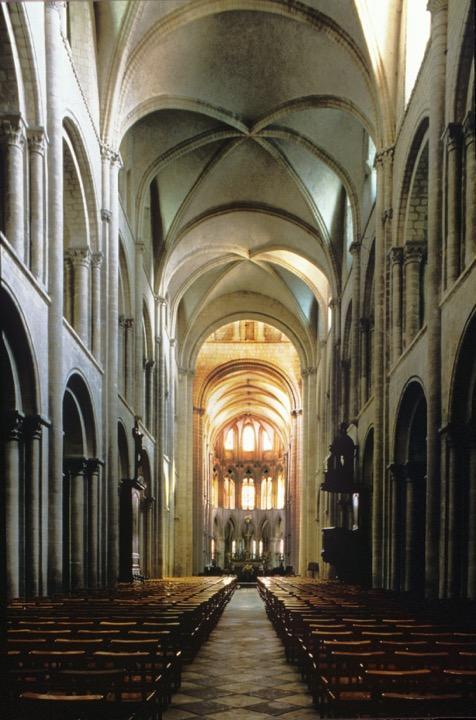 The three-story nave elevation, (predictable by the three-story façade) opens on a side aisle and has a