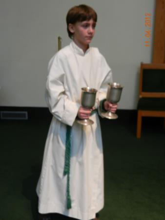 2. Candle Bearer A - carry one of the candles to and from the Ambo (Podium) - walk with the candle before the Gospel, stand at the Ambo during the Gospel, place in