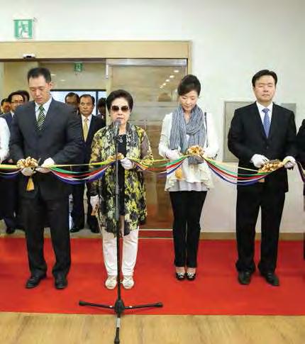 History and Scale of the Archives True Mother cutting the tape with her Kwon Jin Nim, Sun Jin nim and In Sup nim children and son-in-law Director Seog Byung's Kim progress report, accompanied by a