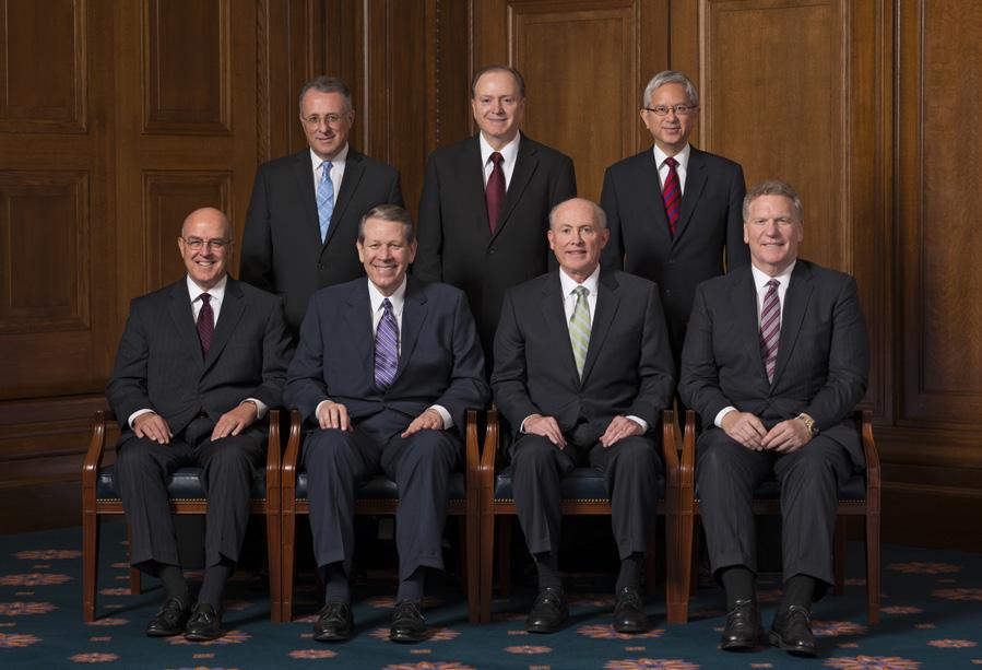 Presidency of the Seventy Seated, from left: Elder L. Whitney Clayton, Elder Donald L. Hallstrom, Elder Richard J.