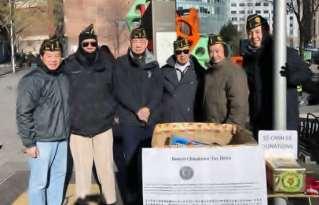 members setup a booth at Chinatown Gate and Boston Greenway for soliciting toys from local