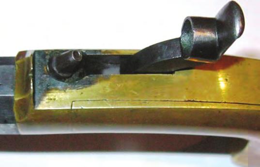 The hammer is Figure 13. A Fairbanks belt or holster pistol with a 7-inch barrel. The barrel is part round, part octagonal, with a one piece hammer/trigger identical to the pocket model.