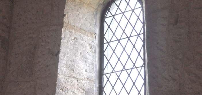 The head of the arch has had new stonework at the time of the insertion of the window, again a pretty poor job.