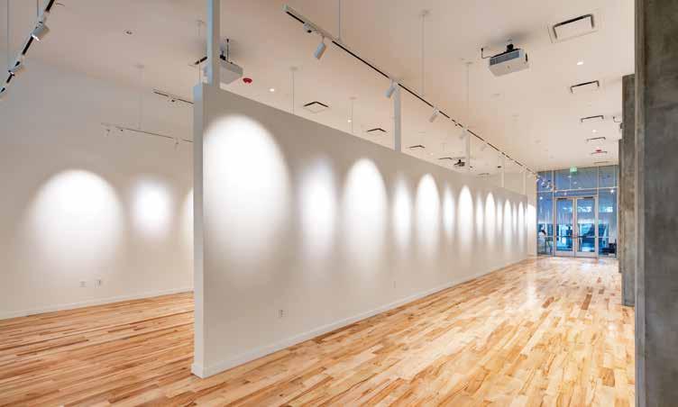 The well-lit space is ideal for featuring various art exhibits. The structure was left exposed to increase acoustical volume and meet stringent acoustical requirements. And that s not all.