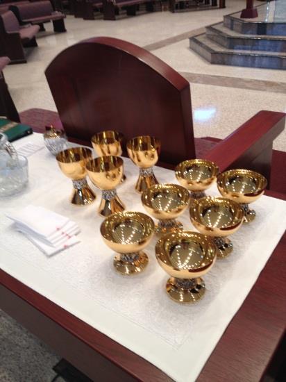 Tabernacle the locked container in which the Eucharistic bread is reserved after the celebration of the Mass.