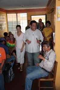 Luis René preaches and leads the community in prayer.