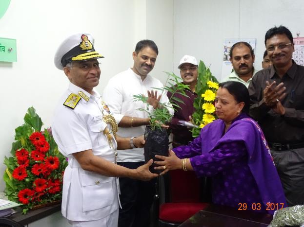 Vice Admiral Mr. Sunil Bhokre is accepting live green gift from us and with team members of.