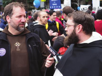 Walking nearly two miles, friars led others in praying the rosary, singing and engaged people in conversation around the issues of human life and