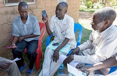 USING AUDIO SCRIPTURES TO SHARE THE GOSPEL At a village church in the Kabwa language area in Tanzania, a large group of people have gathered to listen together to the Word of God.