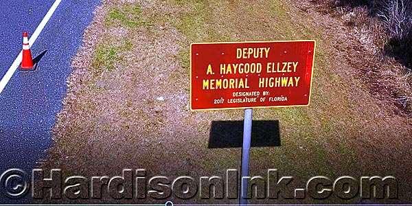 The sign designating the Deputy A. Haygood Ellzey Memorial Highway is photographed from the air for the first time on Jan. 25.