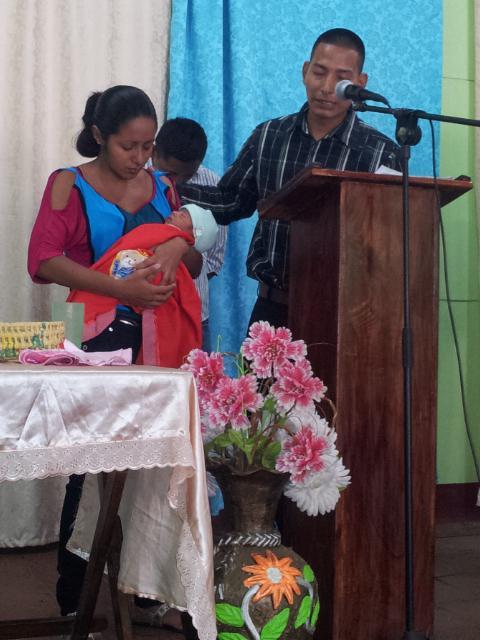 Our sister Darling presenting her baby to God and