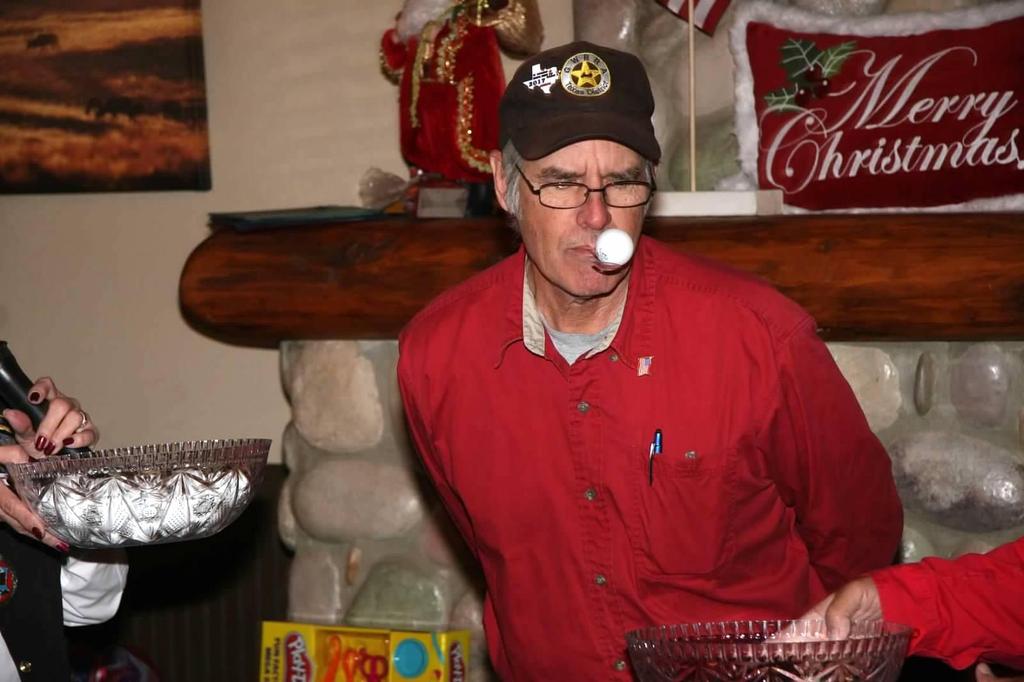 GWRRA Texas State Assistant Director Tom Sprague playing Christmas games One of the novelties of our Christmas party program was