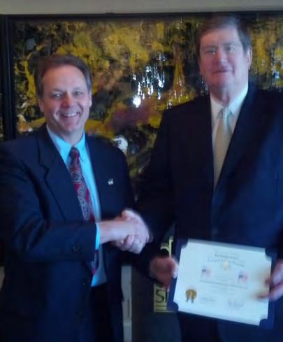 COOK CHAPTER Jeff Hornung, president of the chapter presented a Flag Certificate to Dayton Molendorp, CEO of OneAmerica Financial Partners at a