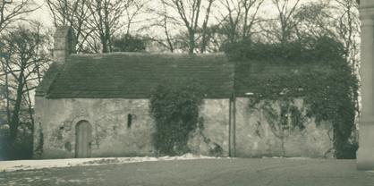chapel. It is still Church property. The chapel is now entered from the south side. To the left of the entrance, against the west wall, is a stone basin, raised on a pillar.