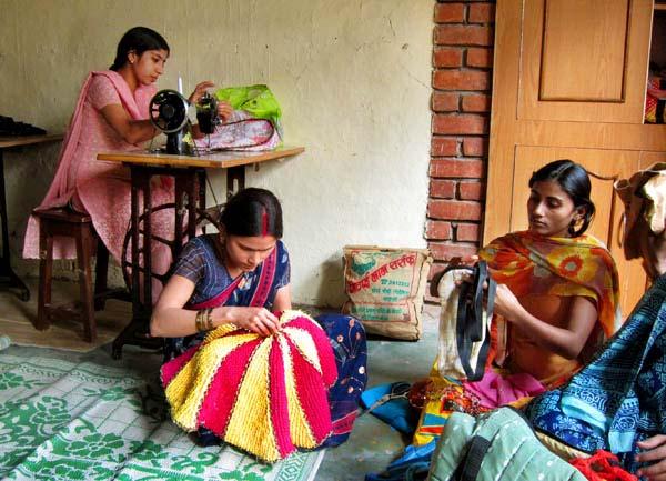 Left: Women from Project Shakti practicing their new sewing skills. Right: preparing chilies for pickling.